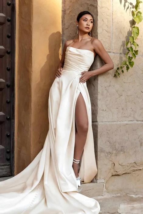 Model wearing a white gown by Essense of Australia